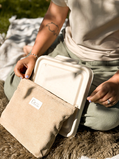 Women with her biodegradable placenta container and birth bag outside, Cosy Mama