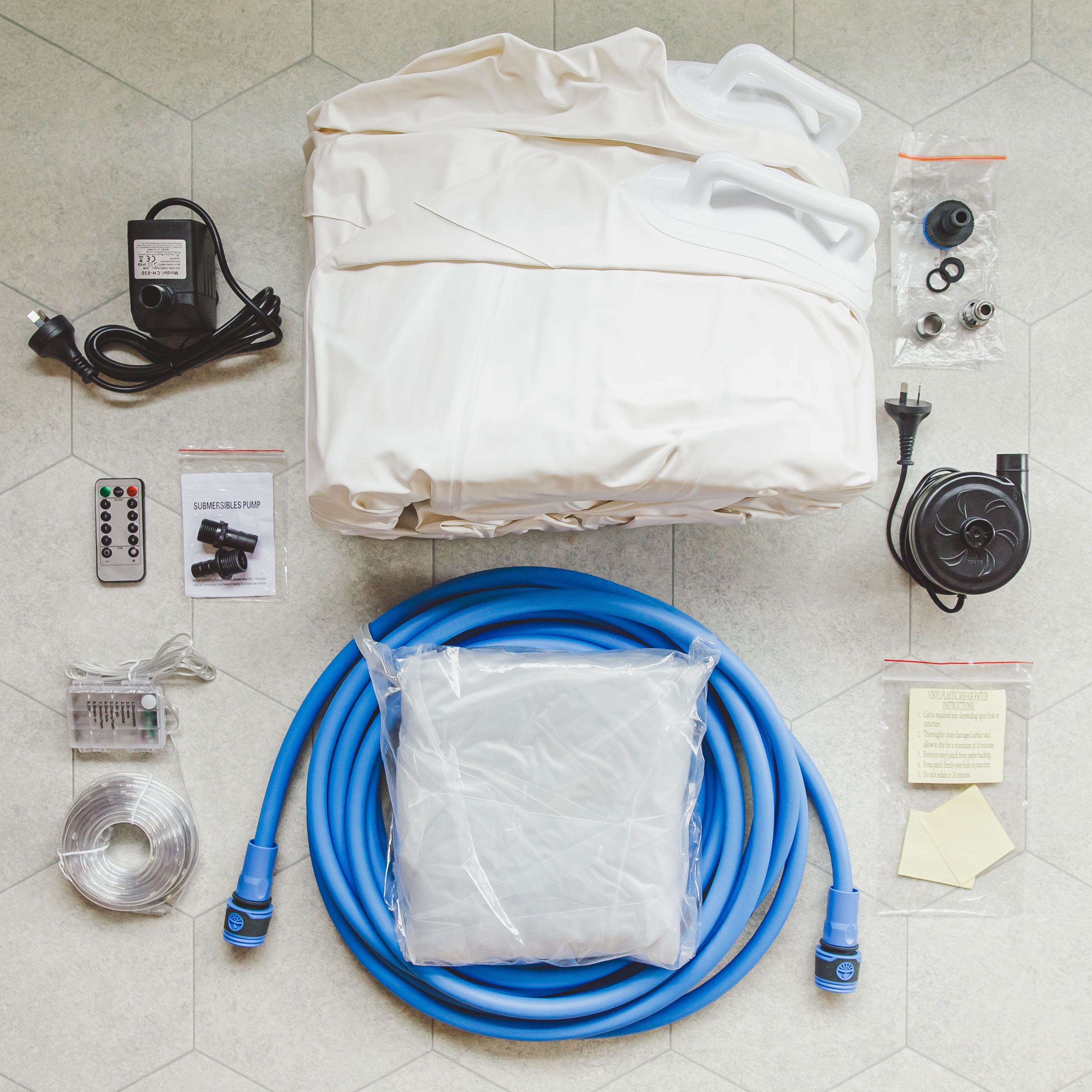 Collection of supplies for Birth Pool Set up (tap adapter, hose, emptying pump, air pump, fairy lights and birth pool)