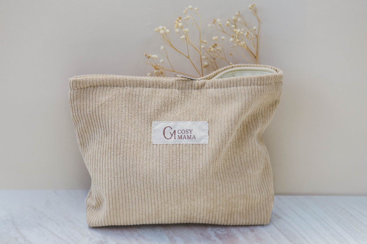 Beige corduroy bag with 'Cosy Mama' label on a light background