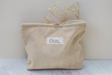 Beige corduroy bag with 'Cosy Mama' label on a light background