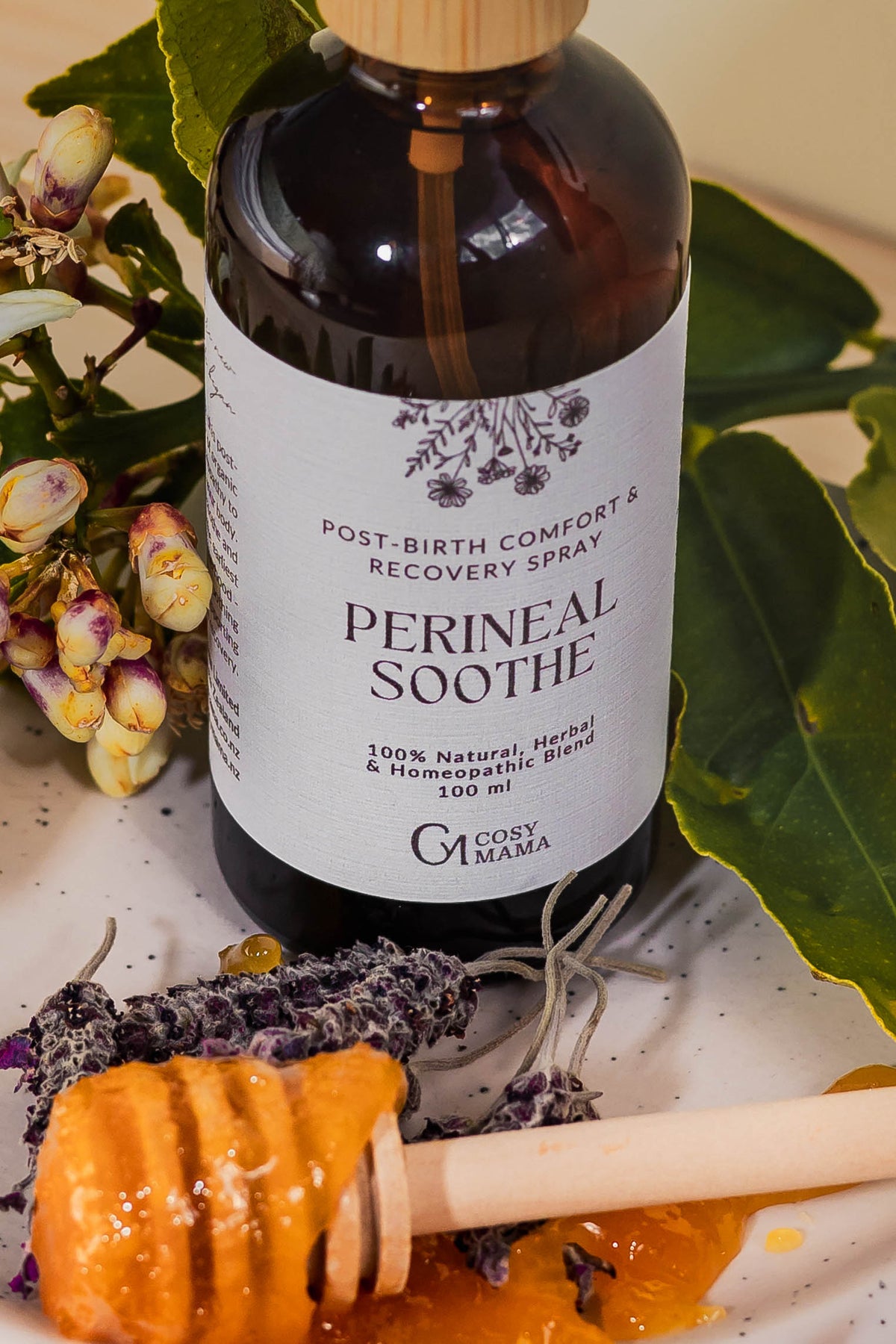 Perineal soothe spray in an amber bottle