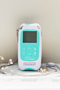 TENS Machine with dried flowers around for decoration